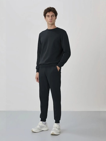 Tommy Life Trainingspak in Blauw: voorkant
