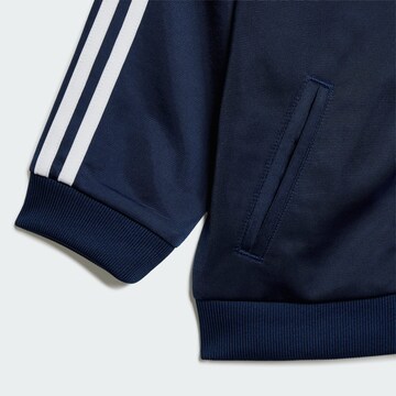 ADIDAS ORIGINALS Костюм для бега 'Firebird' в Синий