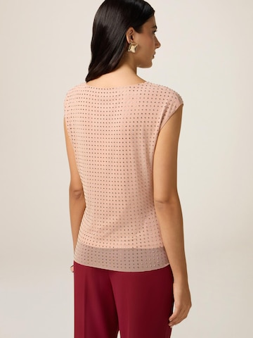 Top di oltre in rosa