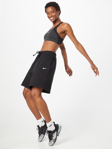 Nike Sportswear Szeroka nogawka Spodnie w kolorze czarny