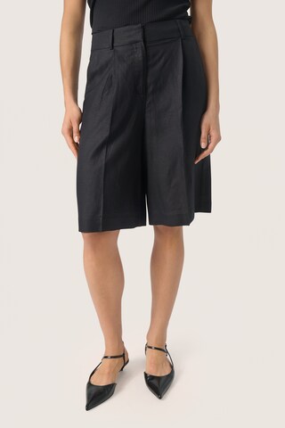 SOAKED IN LUXURY Loose fit Pleat-front trousers 'Malia' in Black: front