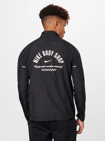 Veste de sport 'MILER' NIKE en noir