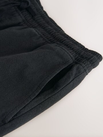Next Loosefit Shorts in Schwarz