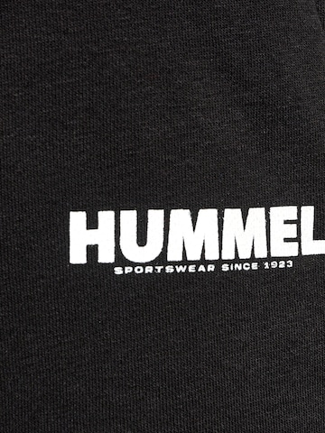 Effilé Pantalon de sport Hummel en noir