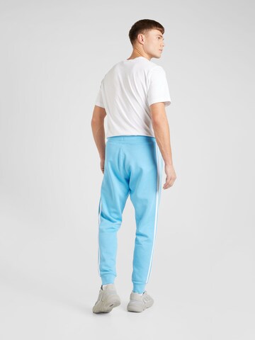 Tapered Pantaloni de la ADIDAS ORIGINALS pe albastru