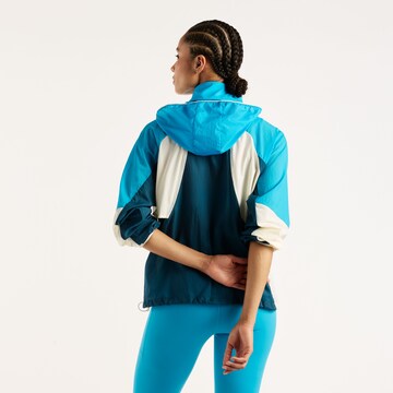 new balance - Chaqueta deportiva en azul