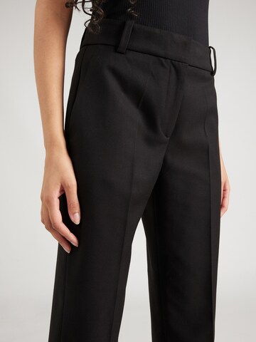 Coupe slim Pantalon à plis TOMMY HILFIGER en noir