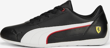 Baskets basses PUMA en noir : devant