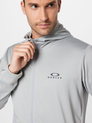 OAKLEY Sportsweatjacke in Grau