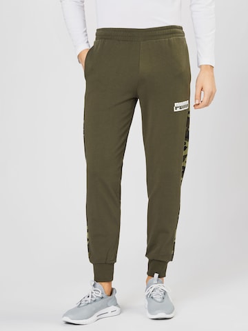 Tapered Pantaloni sportivi di PUMA in verde: frontale