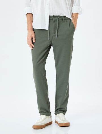 Koton Slim fit Pants in Green: front