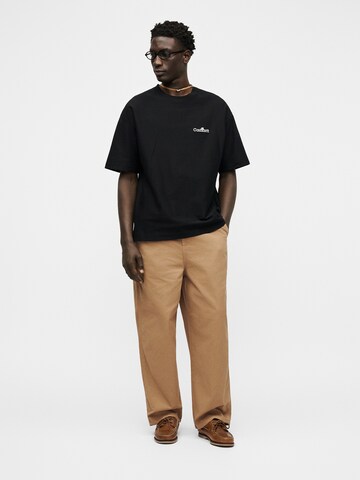 Carhartt WIP Baggy Laskoshousut 'Holden' värissä ruskea