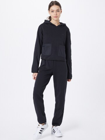 Effilé Pantalon cargo ADIDAS ORIGINALS en noir