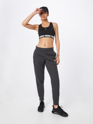 Effilé Pantalon de sport 'Essentials' PUMA en gris