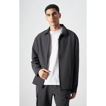 Champion Authentic Athletic Apparel Sportjacke 'Legacy' in Schwarz: Vorderseite