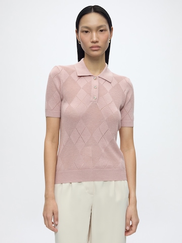 GUESS Sweter w kolorze różowy: przód