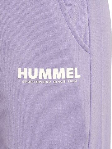 Effilé Pantalon de sport 'Legacy' Hummel en violet