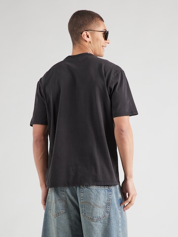 GUESS Originals Футболка 'GO STRIKER' в Черный