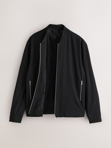 Next - Chaqueta de entretiempo 'Motionflex' en negro