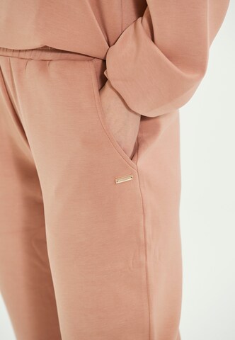 Athlecia Tapered Urheiluhousut värissä beige