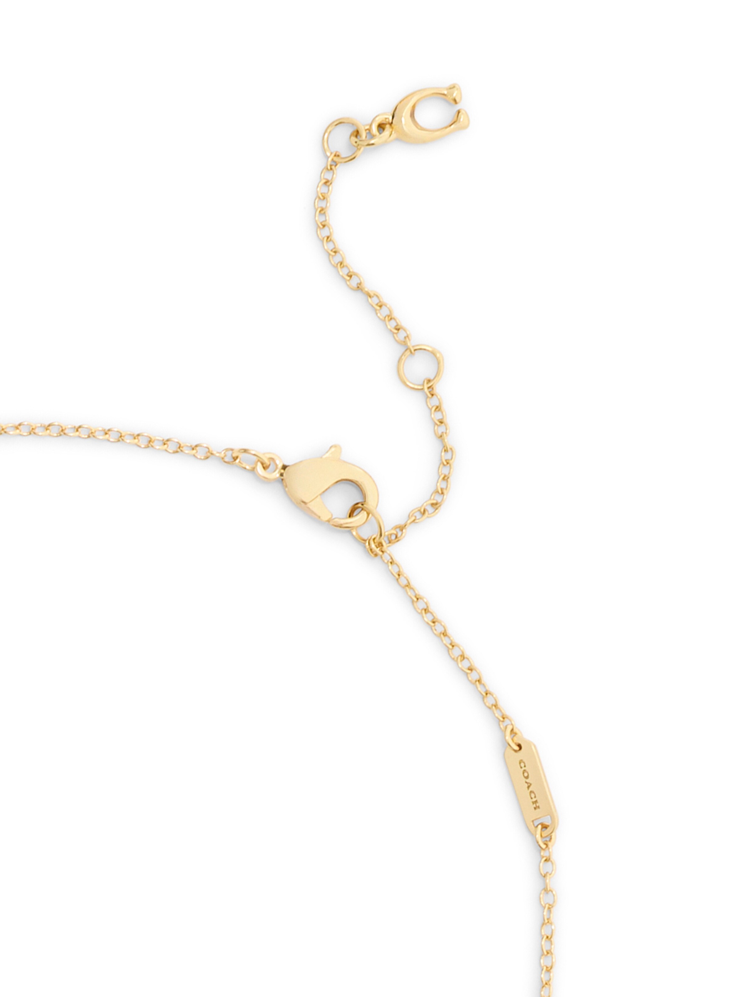 Parure de bijoux COACH en or