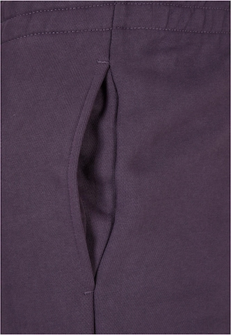 Tapered Pantaloni di Urban Classics in lilla