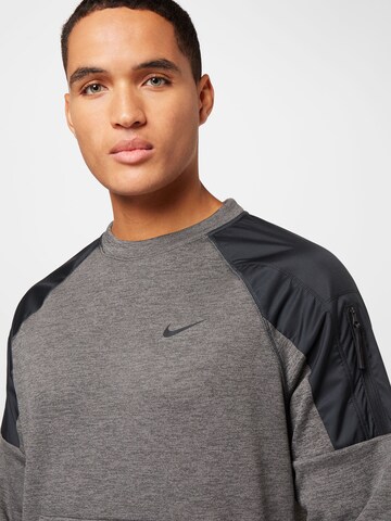 Sweat de sport NIKE en gris