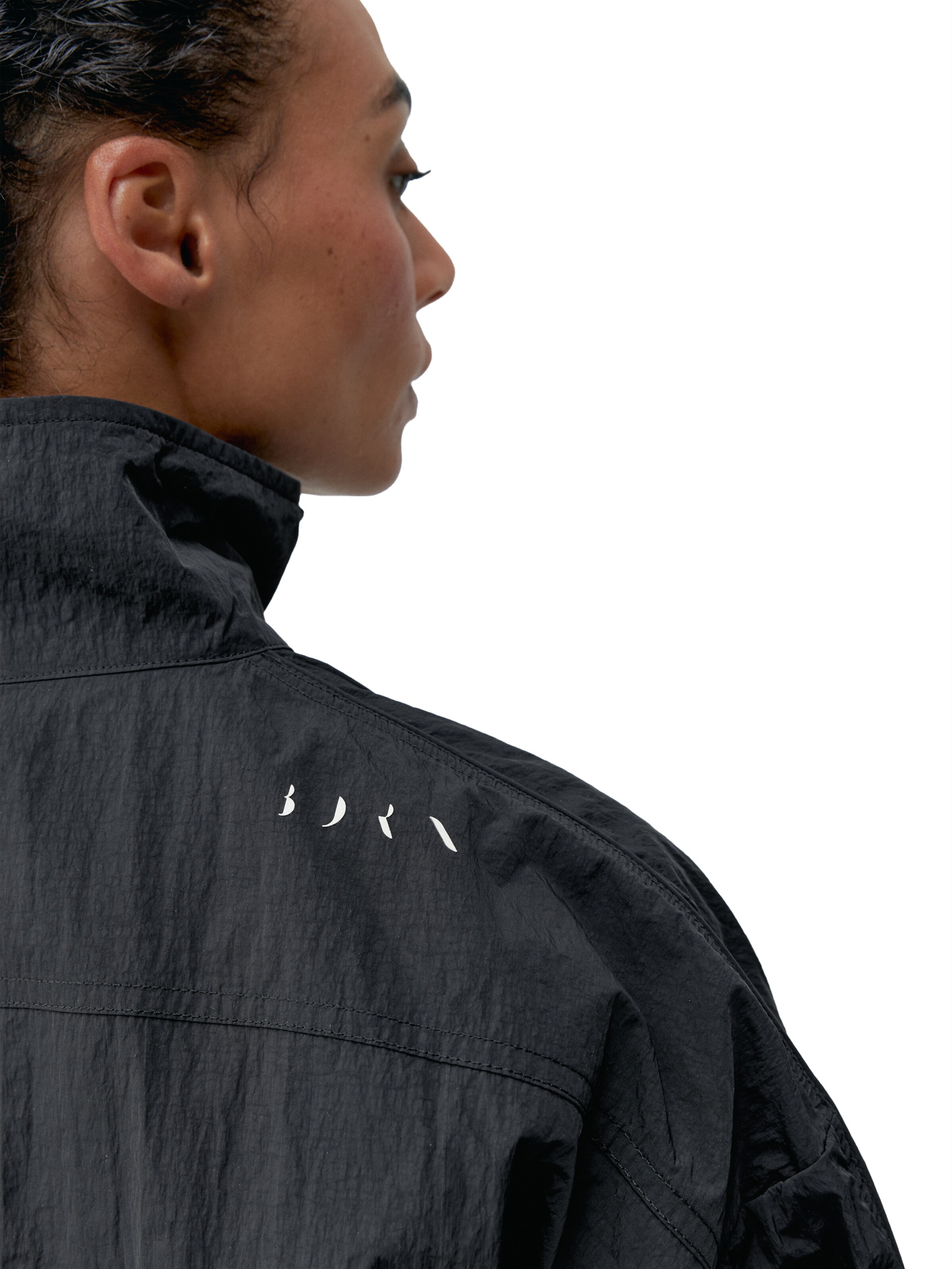 Born Living Yoga Tussenjas 'Amara' in Zwart