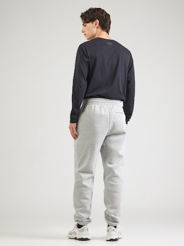 UNDER ARMOUR - Tapered Pantalón deportivo en gris