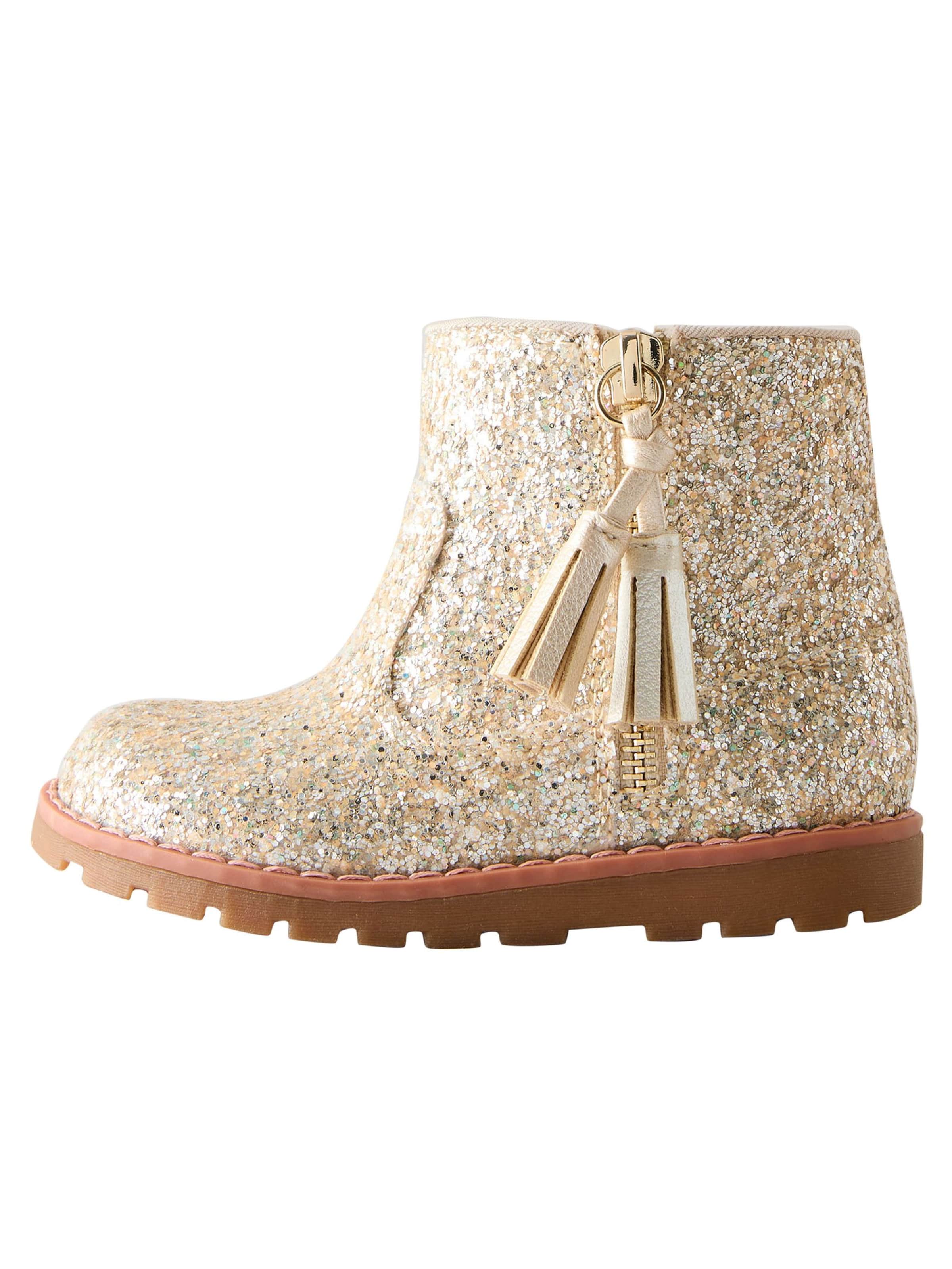 Next Støvler i guld: forside