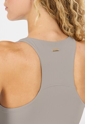 Athlecia Sports top 'Rihal' in Grey