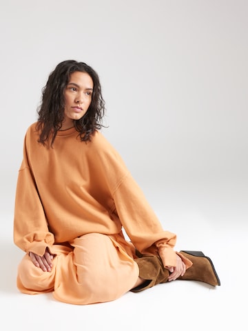 ABOUT YOU x Kamila Šikl Sweatshirt 'Nola' in Orange
