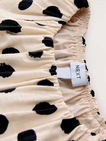 Next Pusero värissä beige