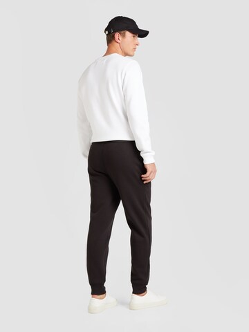 Tapered Pantaloni di Calvin Klein Jeans in nero