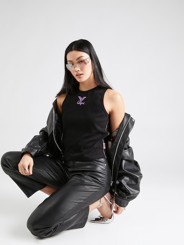 Top in maglia di Carlo Colucci in nero