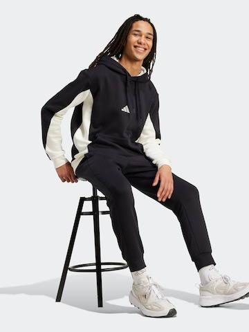 ADIDAS SPORTSWEAR - Chándal en negro: frente