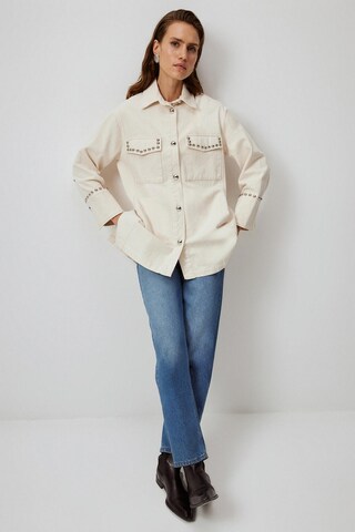 Touche Prive Tussenjas in Beige: voorkant