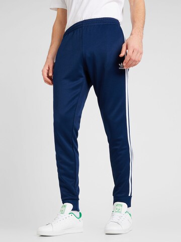 ADIDAS ORIGINALS Tapered Broek 'Adicolor Classics SST' in Blauw: voorkant