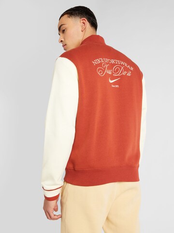 Nike Sportswear Prechodná bunda 'VARSITY' - oranžová