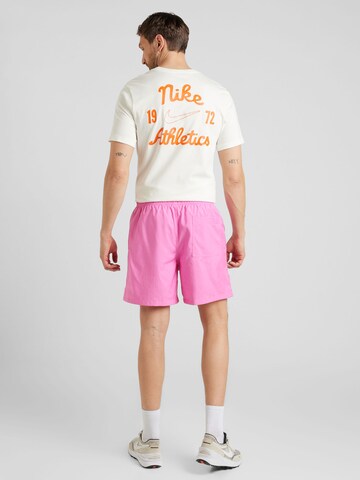Nike Sportswear Lużny krój Spodnie 'CLUB' w kolorze różowy