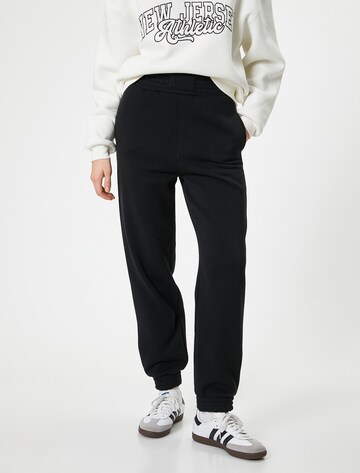 Koton Tapered Pants in Black: front
