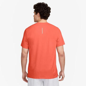 NIKE Funktionsshirt 'Rise 365' in Orange