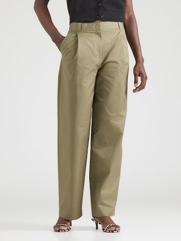 & Other Stories regular Παντελόνι πλισέ σε πράσινο: μπροστά