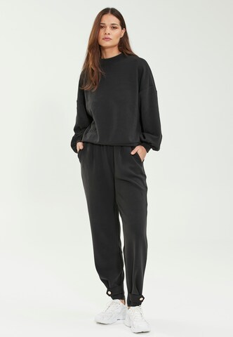 Athlecia Loose fit Workout Pants 'Nikoni' in Black