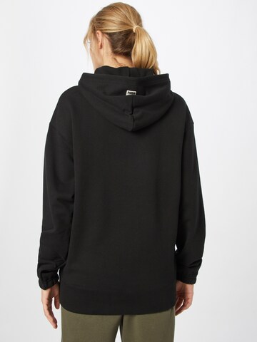 PUMA Sweatshirt 'PUMAxABOUT YOU' in Schwarz