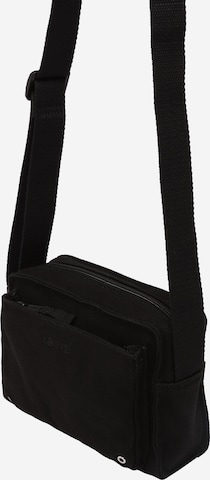 LEVI'S ® Skuldertaske i sort