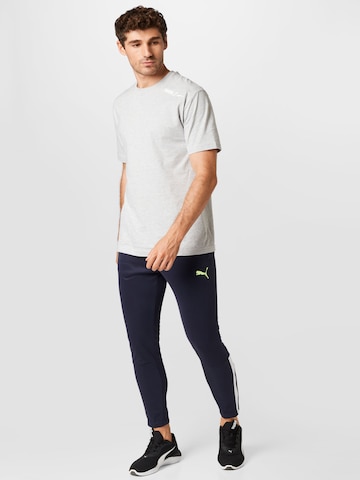 PUMA Tapered Sportbyxa i blå