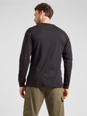 Tommy Jeans Bluser & t-shirts 'LINEAR' i sort