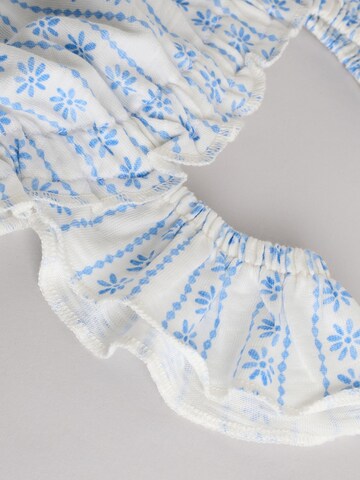 Ensemble Next en blanc