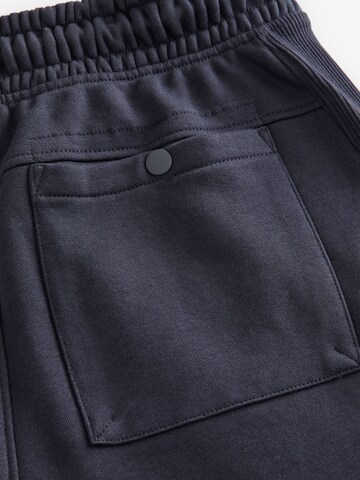 Next Tapered Gargohousut värissä sininen